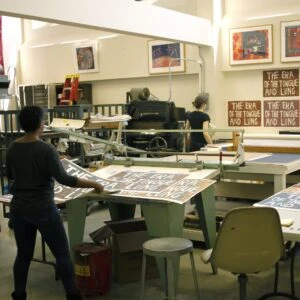 Artist Ayanah Moor and printer Veronica Hanssens reviewing prints at Brandywine Workshop